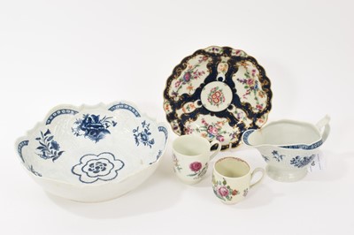 Lot 120 - Group of 18th century Worcester porcelain, including blue and white floral painted junket dish and sauceboat, a blue scale ground dish, and two polychrome painted coffee cups (5)