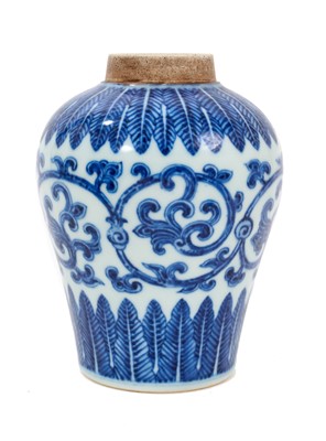 Lot 124 - A Chinese blue and white porcelain jar, Qianlong mark to base but probably 19th century, painted in the Ming style with a scrolling lotus pattern, 13.75cm high