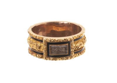 Lot 508 - George IV gold and black enamel mourning ring, the wide gold band with glazed hairwork plaque and foliate gold borders, inscribed "Sir Wm. Forbes Died. 24th Oct. 1828 Aged 56", ring size approxi...