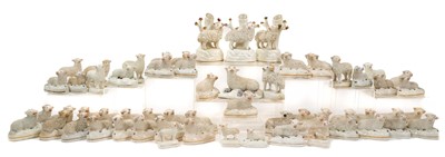 Lot 140 - A wonderful collection of 19th century Staffordshire pottery sheep, including spill vases, standing models and seated models (61)