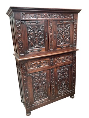 Lot 1634 - 17th century style carved oak two height cupboard