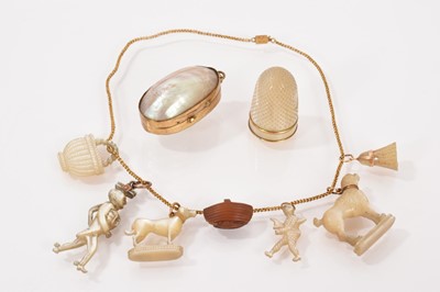 Lot 538 - Group of seven 19th century carved mother of pearl charms and similar thimble
