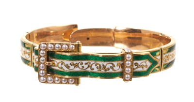 Lot 554 - Late 19th century gold, enamel and pearl hinged bangle, the green and white enamel band with a pearl buckle.