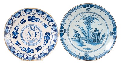 Lot 152 - A rare English blue and white delftware marriage dish, inscribed with the initials 'M A F' and the date '1733', with foliate borders, 21.75cm diameter, together with another 18th century delft d...