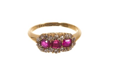 Lot 691 - Late Victorian ruby and diamond triple cluster ring with three round mixed cut rubies surrounded by a border of old cut diamonds in gold claw setting on 18ct gold shank, Chester 1901, ring size...