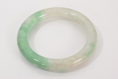 Lot 693 - Chinese jade/green hardstone bangle, 8cm diameter