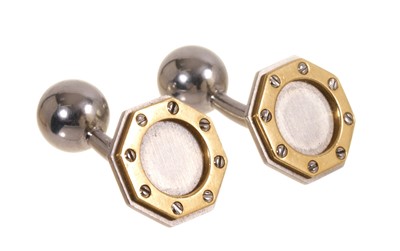 Lot 708 - Pair of Cartier 'Santos' stainless steel and yellow gold octagonal cufflinks with screw motifs