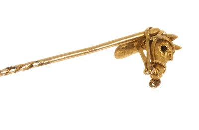 Lot 713 - Victorian gold horse head tie/ stick pin with a cabochon ruby set to the reins, 80mm