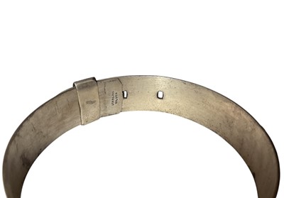 Lot 1 - 1960s silver hinged bangle with floral decoration (Birmingham 1962), together with a sterling silver buckle-style bangle (2)