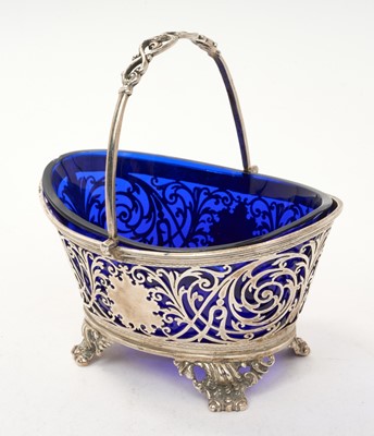 Lot 455 - Late Victorian silver swing handled basket of oval form, with pierced decoration