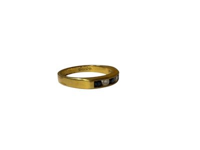 Lot 16 - 18ct gold diamond and sapphire seven stone ring in a channel setting