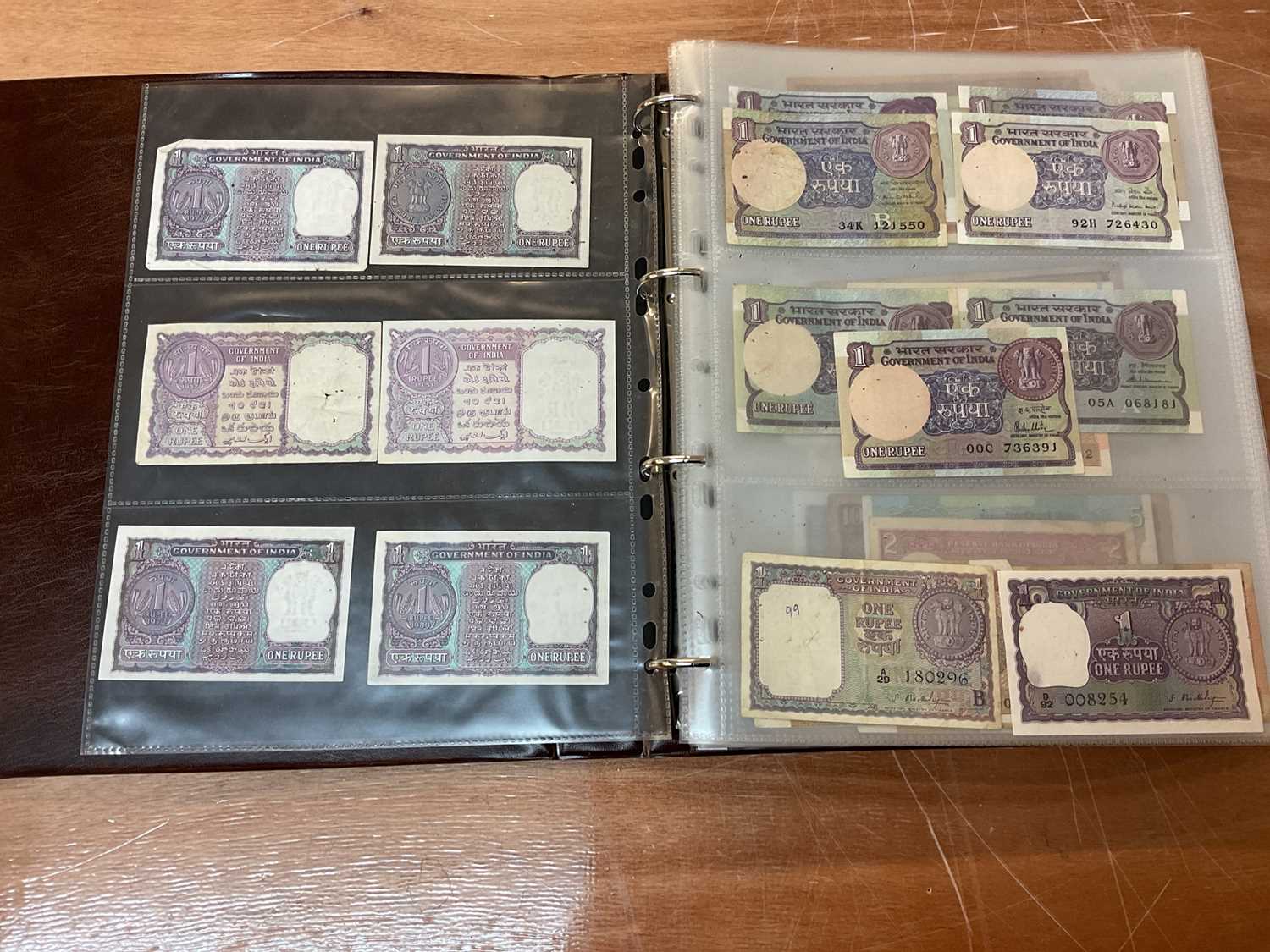 Lot 422 - India - An album containing predominately Republic Bank of India mixed banknotes to include consecutively numbered issues in uncirculated condition, Burma Military issues of George VI, Bank of B...