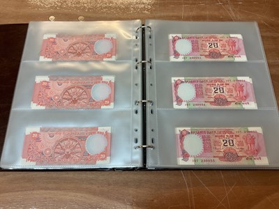 Lot 422 - India - An album containing predominately Republic Bank of India mixed banknotes to include consecutively numbered issues in uncirculated condition, Burma Military issues of George VI, Bank of B...