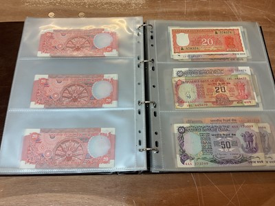 Lot 422 - India - An album containing predominately Republic Bank of India mixed banknotes to include consecutively numbered issues in uncirculated condition, Burma Military issues of George VI, Bank of B...