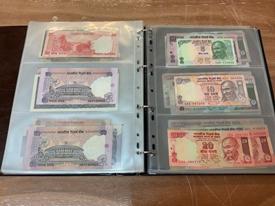 Lot 422 - India - An album containing predominately Republic Bank of India mixed banknotes to include consecutively numbered issues in uncirculated condition, Burma Military issues of George VI, Bank of B...