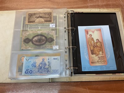 Lot 423 - Thailand - An album containing mixed banknotes to include scarcer mid 20th century issues and others (N.B. Mixed grades) (98 banknotes)