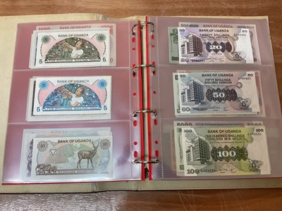 Lot 424 - East Africa - An album containing mixed banknotes with scarcer issues notes (N.B. Mixed grades) (120 banknotes)