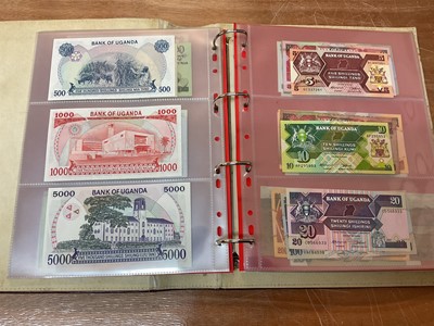 Lot 424 - East Africa - An album containing mixed banknotes with scarcer issues notes (N.B. Mixed grades) (120 banknotes)