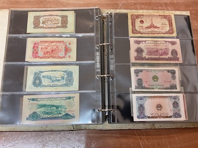 Lot 425 - World - An album containing Laos, Vietnam, Nepal etc. mixed banknotes with scarcer issues noted (N.B. Mixed grades) (243 banknotes)