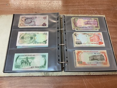 Lot 425 - World - An album containing Laos, Vietnam, Nepal etc. mixed banknotes with scarcer issues noted (N.B. Mixed grades) (243 banknotes)