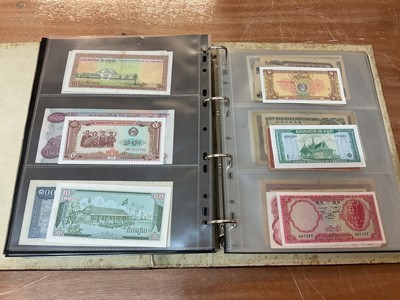 Lot 425 - World - An album containing Laos, Vietnam, Nepal etc. mixed banknotes with scarcer issues noted (N.B. Mixed grades) (243 banknotes)