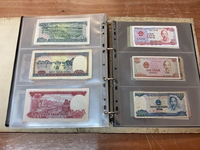 Lot 425 - World - An album containing Laos, Vietnam, Nepal etc. mixed banknotes with scarcer issues noted (N.B. Mixed grades) (243 banknotes)