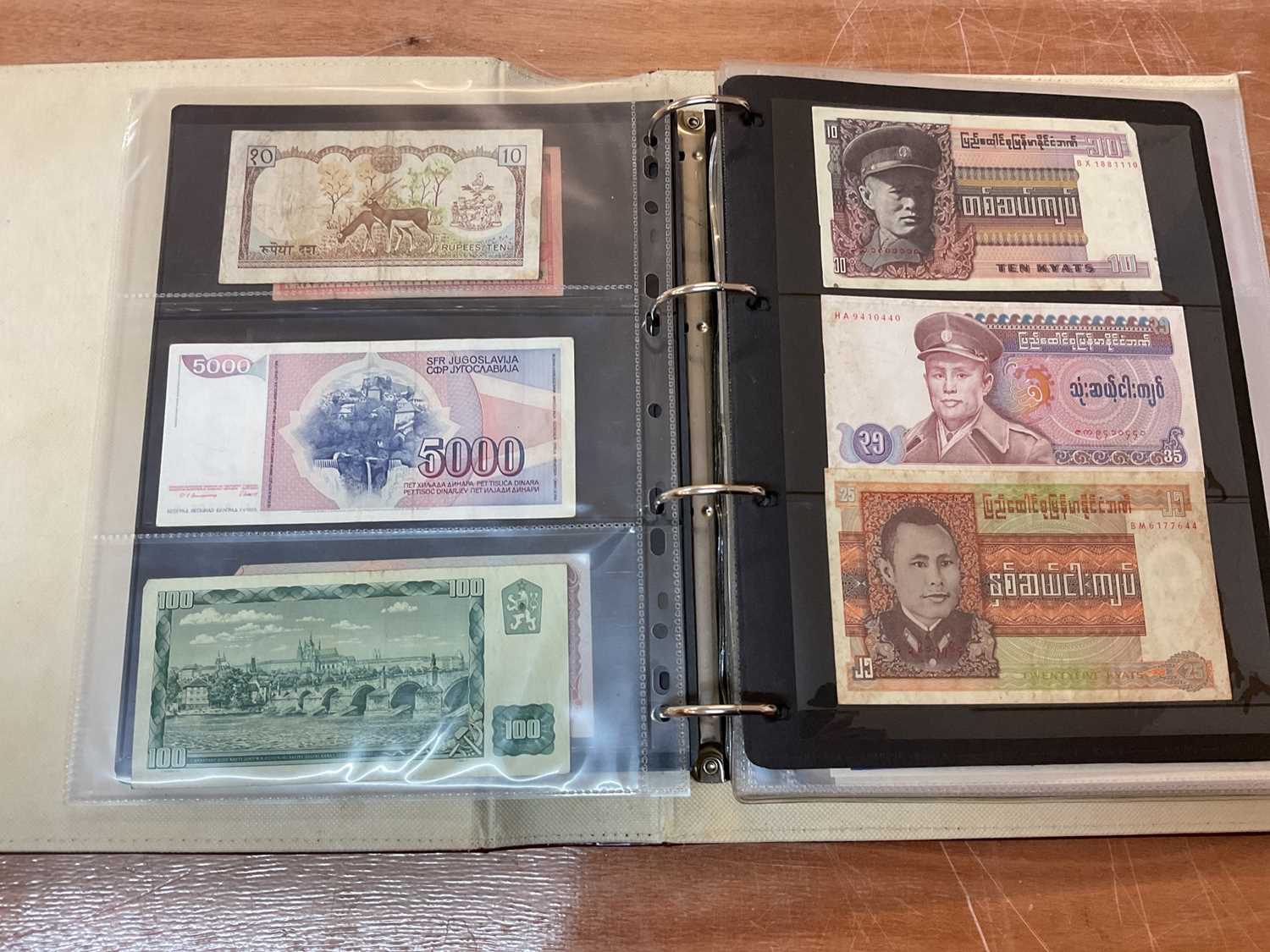 Lot 426 - World - An album containing Burma, Myanmar, Cuba etc. mixed banknotes (N.B. Mixed grades) (Qty)