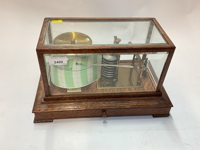 Lot 2400 - An oak-cased brass barograph, 36cm wide