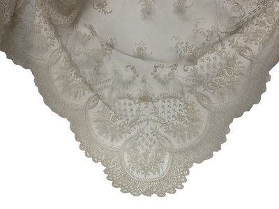 Lot 2053 - Fine 19th century Brussels lace wedding veil, worked with tulips, roses, bows etc and scalloped edge.