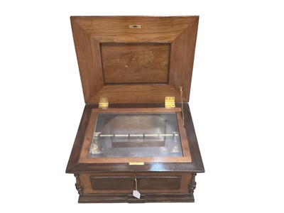 Lot 2213 - Early 20th century Monopol disc musical box, with a disc and winding key, in walnut case
