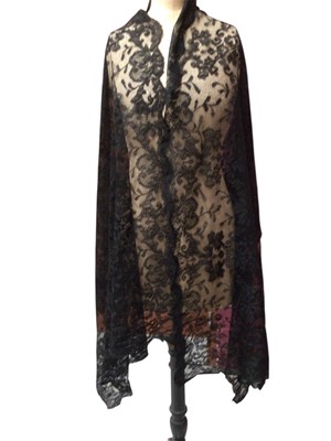 Lot 2058 - Victorian wide black Chantilly lace stole, similar bonnet veil and mantilla. Two white work christening gowns plus petticoat, long vintage gloves and a small quantity of worked table linens.