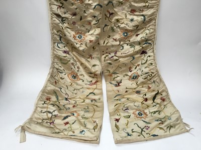 Lot 2060 - Pair of embroidered hangings in scrolling flower design. Pleated onto a cotton tape. 200 x 14 cms. Plus a silk embroidered bell pull.