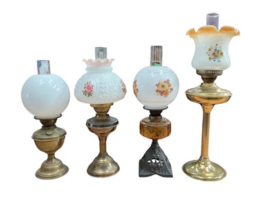 Lot 2658 - Large quantity of oil lamps and related parts to include chimneys, burners and shades.