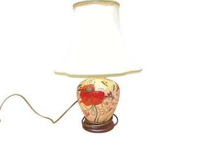 Lot 1151 - Moorcroft pottery table lamp decorated in the Family Through Flowers pattern, 19.5cm high excluding brass fitting