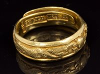 Lot 644 - 19th century Chinese high carat gold ring,...