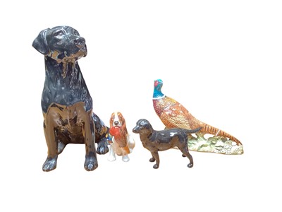 Lot 1145 - Beswick Fireside Labrador, two Royal Doulton dogs and Beswick pheasant (4)