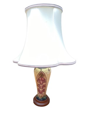 Lot 1156 - Moorcroft pottery table lamp decorated in the Foxglove pattern, 23cm high excluding brass fitting
