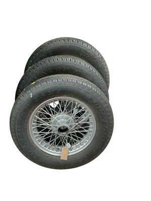 Lot 47 - Group of three silver painted wire wheels and tyres, believed to suit MG TC / TA models (3).