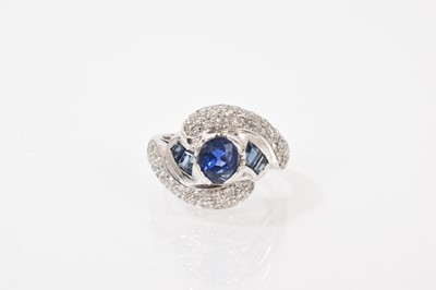 Lot 650 - Art Deco style sapphire and diamond cross over ring