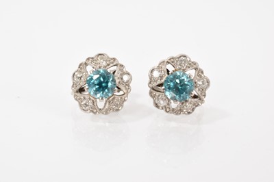 Lot 651 - Pair of blue zircon and diamond cluster screw back earrings
