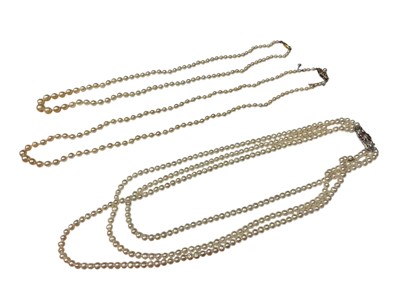 Lot 145 - Cultured pearl three strand necklace with diamond and ruby flower head clasp, and two others