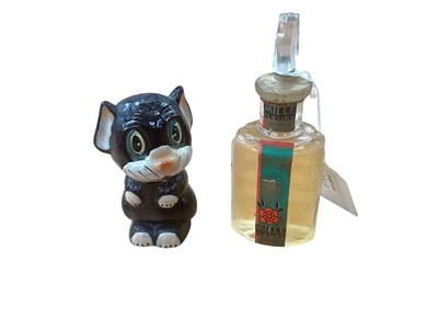 Lot 2502 - 1930s 'Ooloo the Cat' scent bottle, based on the George Ernest Studdy character created in 1929 and featured in The Sketch, together with a 1930s scent bottle with perfume (2)