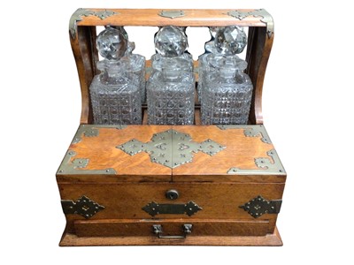 Lot 2403 - Edwardian oak cased three-bottle tantalus