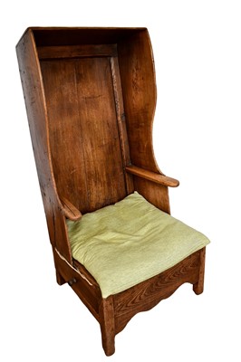 Lot 1296 - George III elm lambing chair with hooded wing back