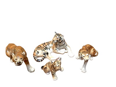 Lot 1187 - Group of three models of tigers and a tiger cub, by Royal Dux and Russian Lomonosov LFZ (4)