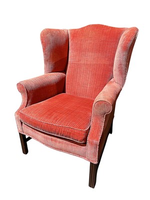 Lot 1542 - Pair of Georgian-style wing armchairs upholstered in coral velvet, on reeded legs joined by stretchers