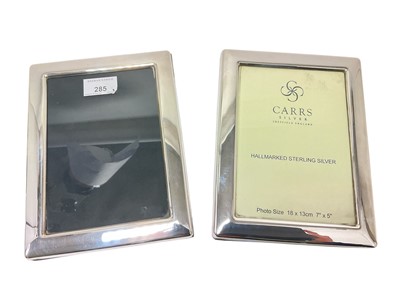 Lot 285 - Pair of contemporary silver photograph frames of rectangular form with easel back supports