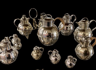 Lot 2406 - Collection of silver plated Guernsey jugs, of varying size, including a cruet