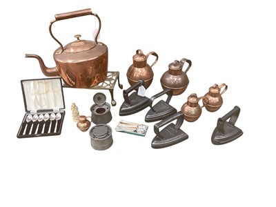 Lot 2407 - Collection of copper Guernsey jugs, a group of antique flat irons, together with a copper kettle and silver plate