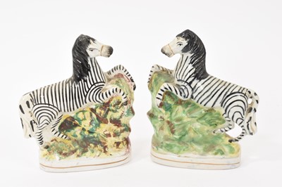 Lot 144 - Pair of Victorian Staffordshire pottery zebras